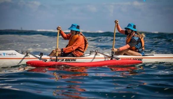 John and Debra Lazarus paddling their homemade OC2 outrigger canoe at the 2026 Prescient Freedom Paddle around Robben Island