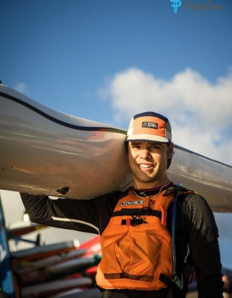 Matthew Finsen carrying his single ski at the 2026 Prescient Freedom Paddle around Robben Island