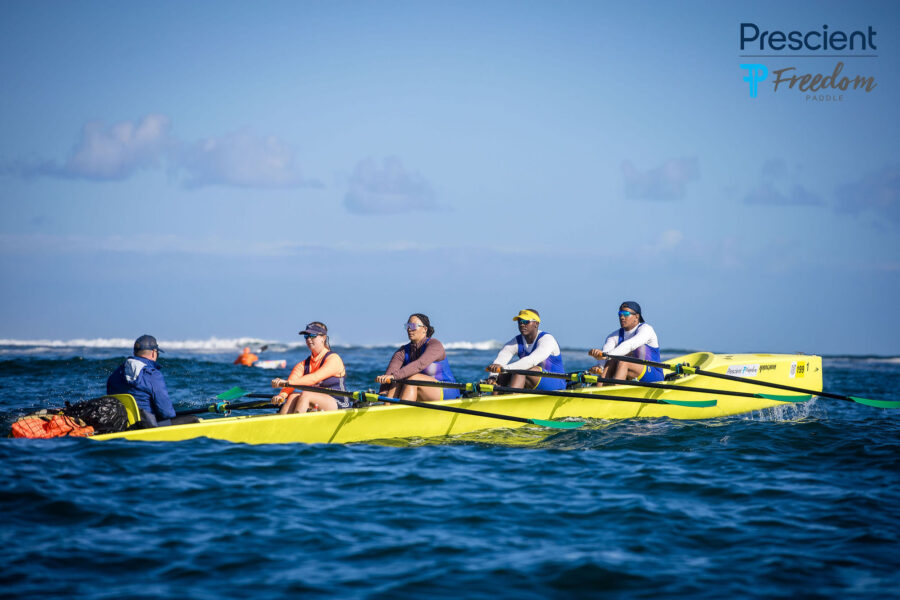 Seema Khehar and the CCRC coastal rowing quad crew racing at the 2026 Prescient Freedom Paddle around Robben Island in their yellow boat #199